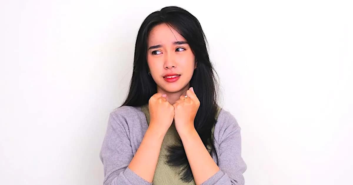 woman looking nervous while trying to think about ways to level up her self worth while overcoming insecurities