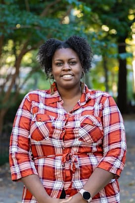 IMG_5008 Philly Blogger founder smiling in red plaid shirt – lifestyle and food blog sharing personal stories, cooking tips, and foodie adventures.