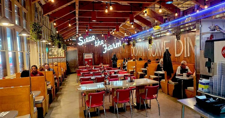 2-4 People sitting and eating at down home diner