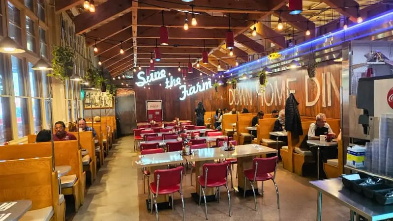 people sitting down at a cozy philly diner - down home diner enjoying a homestyle breakfast