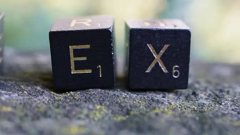 2 black and gold dices to symbolize not talking about your ex as part of first date etiquette