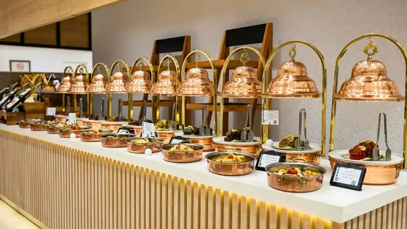 a restaurant displaying a variety of foods in buffet style