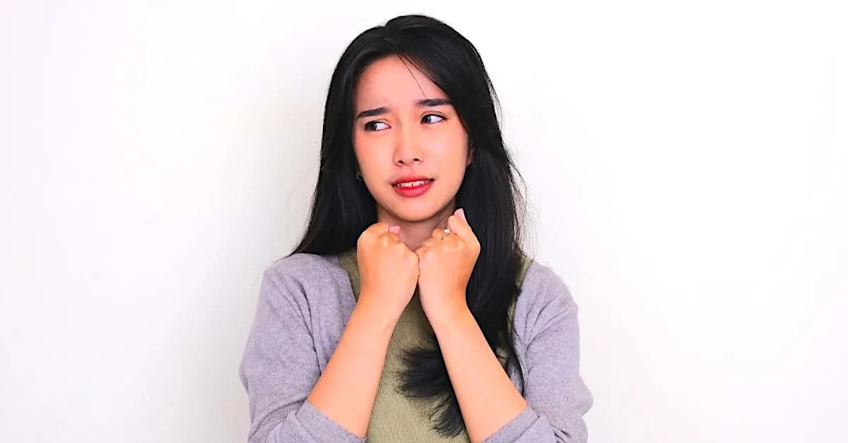 woman looking nervous while trying to think about ways to level up her self worth while overcoming insecurities