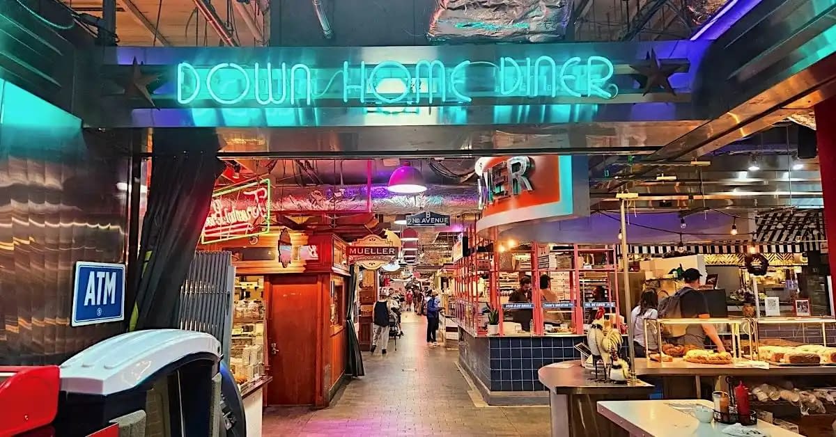 neon blue sign showing down home diner- a breakfast dinner inside reading terminal market